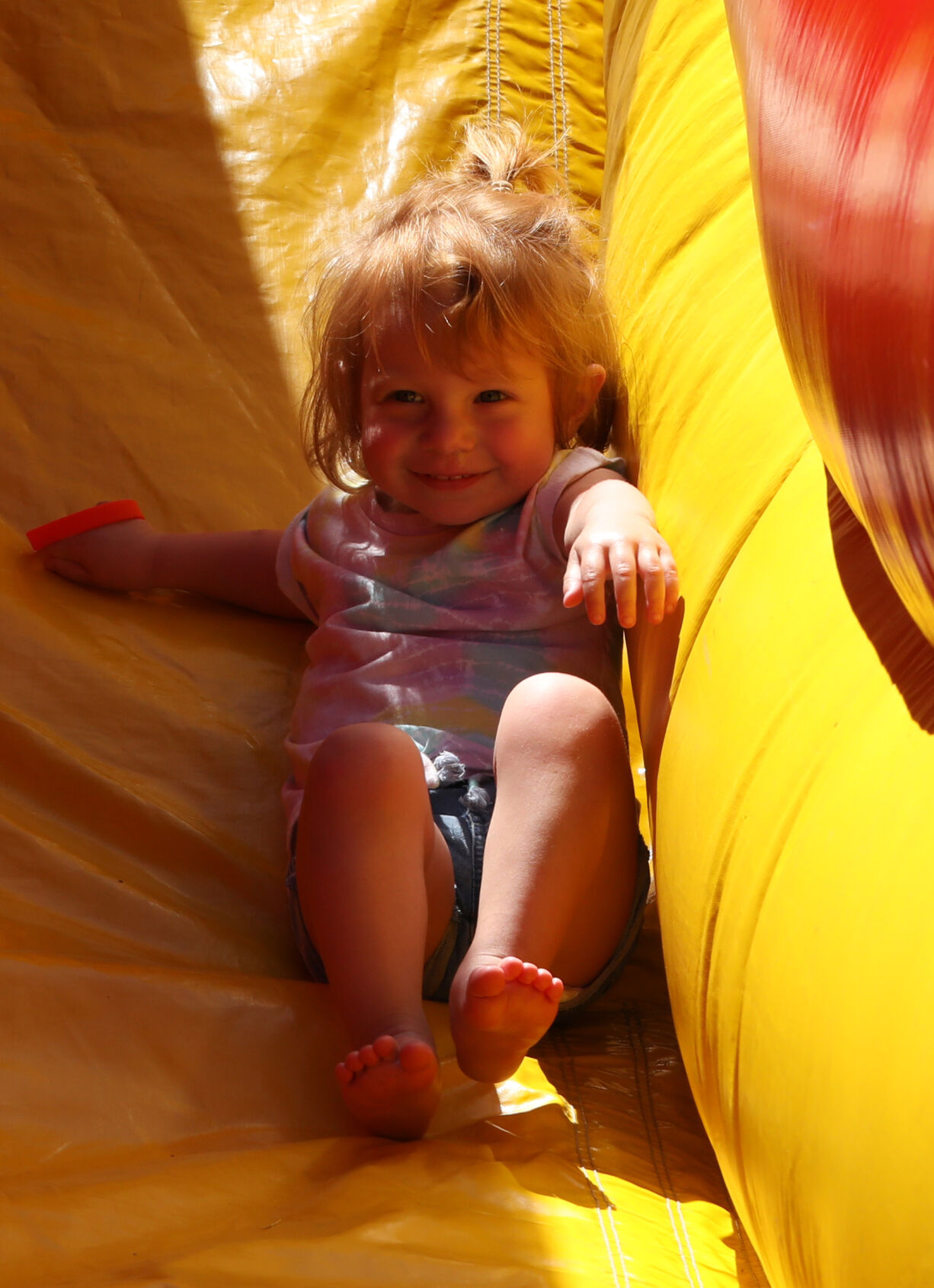 Leona Luttrell goes down a slide